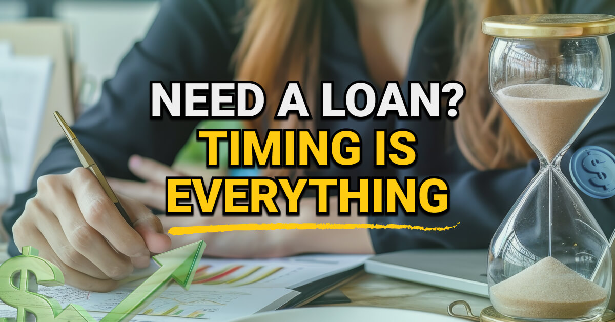 "A woman writing on financial documents beside a sand hourglass, with a green dollar symbol and rising arrow overlay. Text reads: “Need a Loan? Timing Is Everything. "